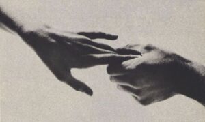 Two hands reaching out for each other through depression, connecting.