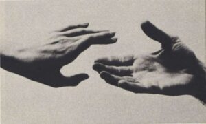 Two hands reaching out for each other through depression, trying to connect.